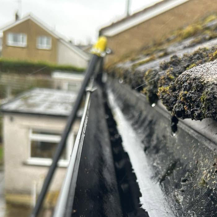 Pressure Washing Andy gutter after clean
