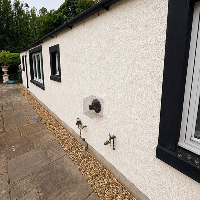Pressure Washing Andy white wall after